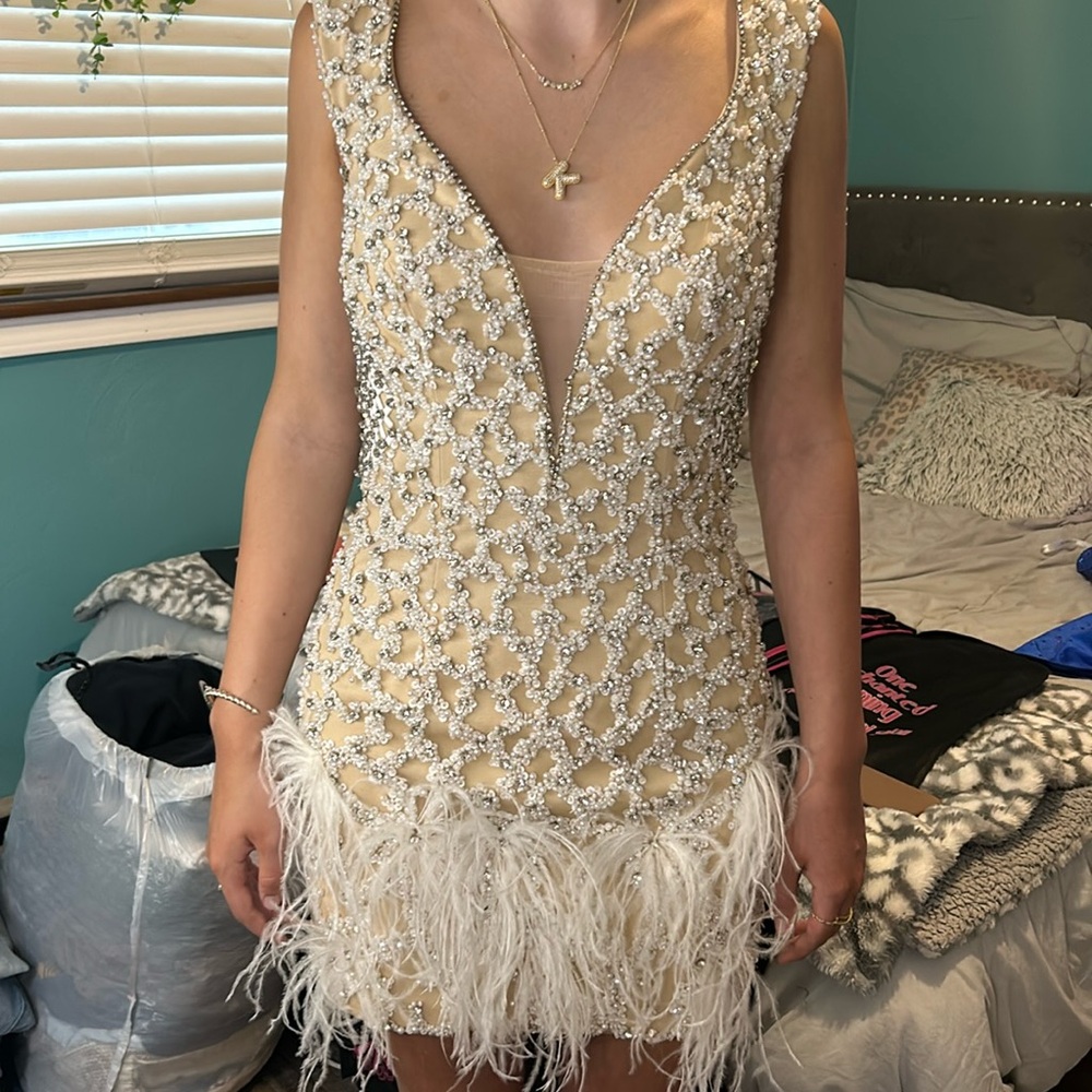 Homecoming dress- size 4 altered by dress store owner to size 0-00. Worn once.